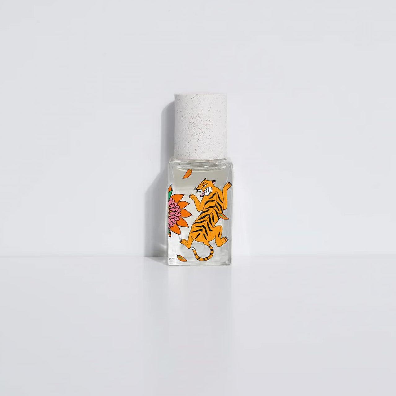 Small bottle with a tiger design on a white background