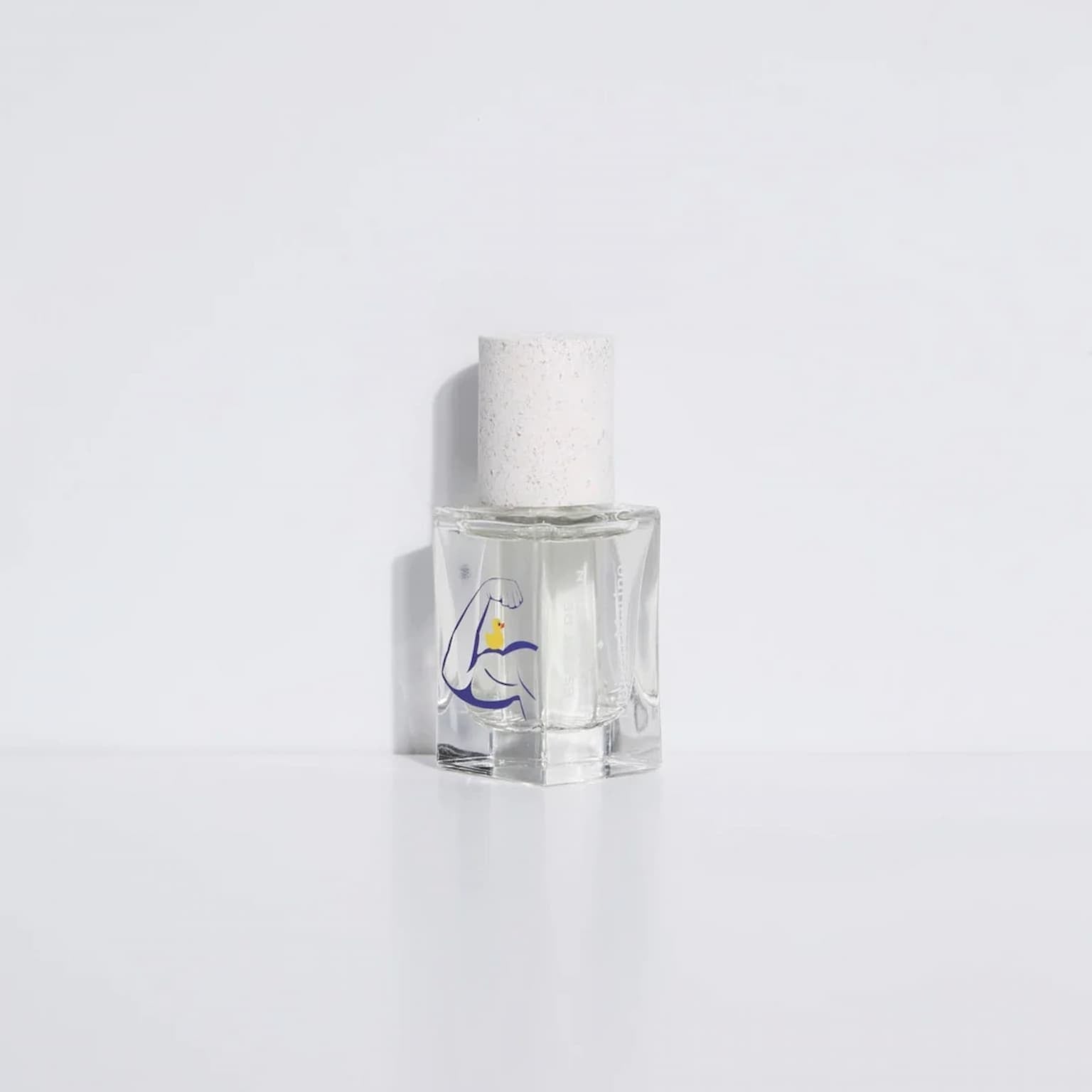 Clear glass bottle with white cap on a white background