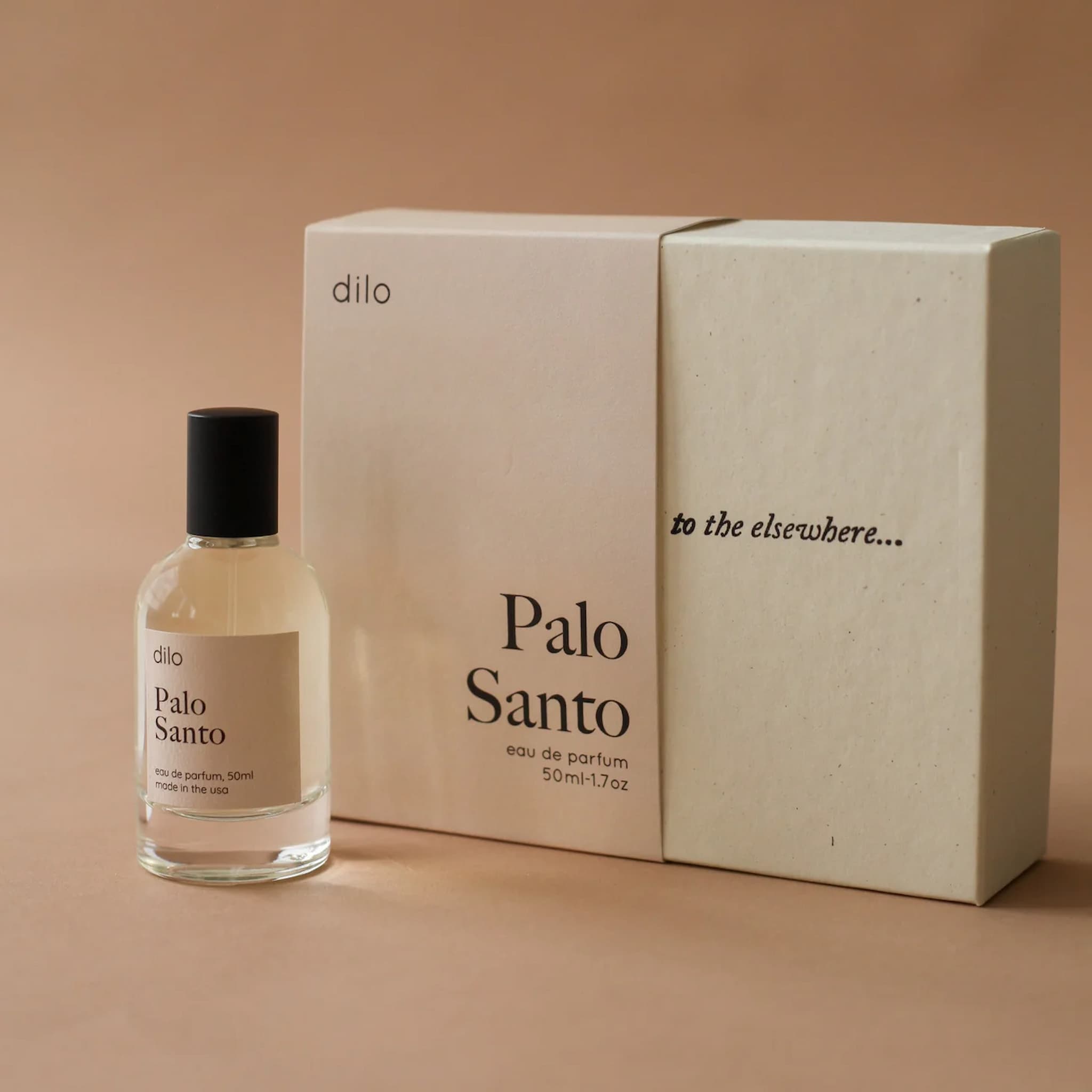 Dilo Palo Santo eau de parfum bottle and packaging on a beige background