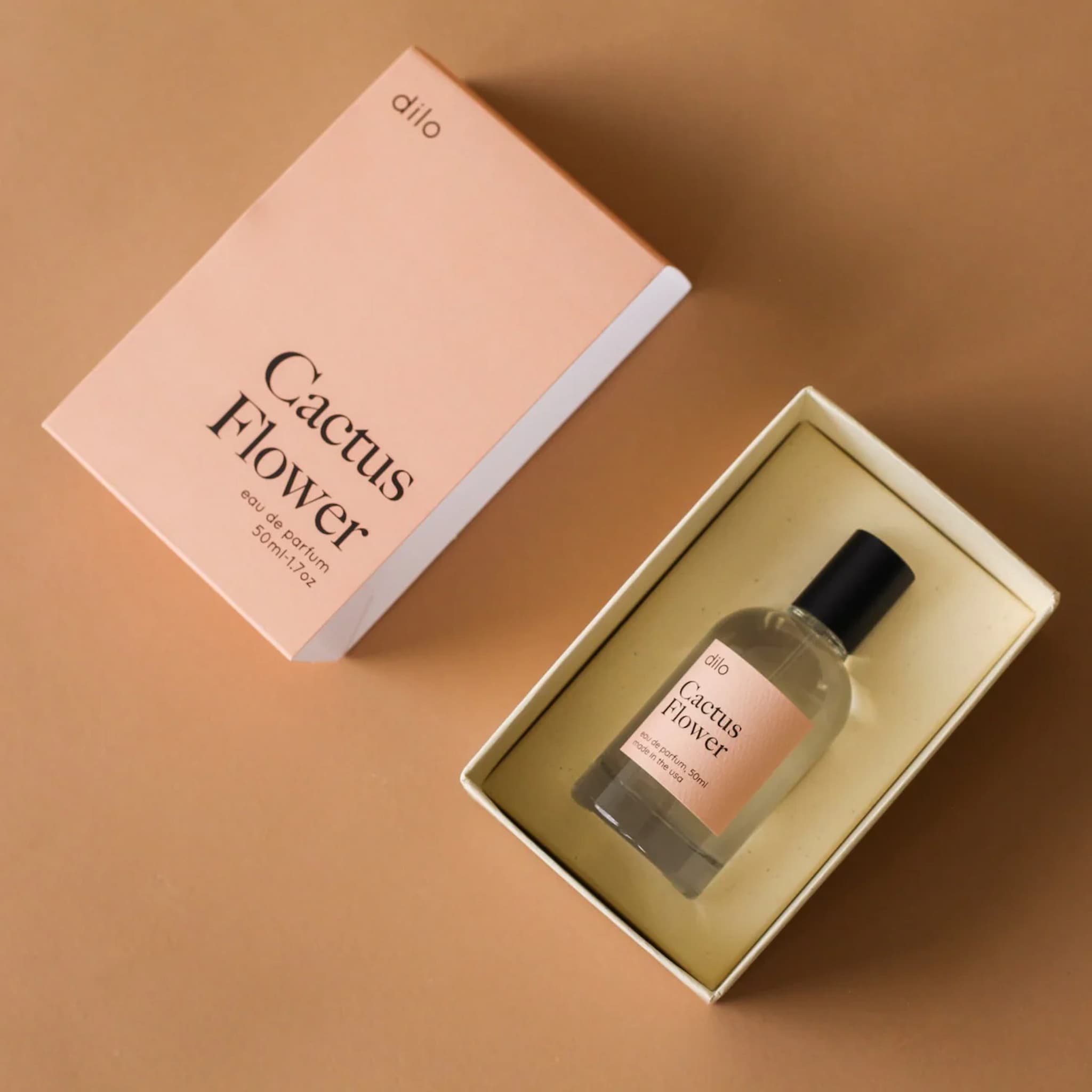 Dilo Cactus Flower perfume bottle in a box with packaging on a brown background