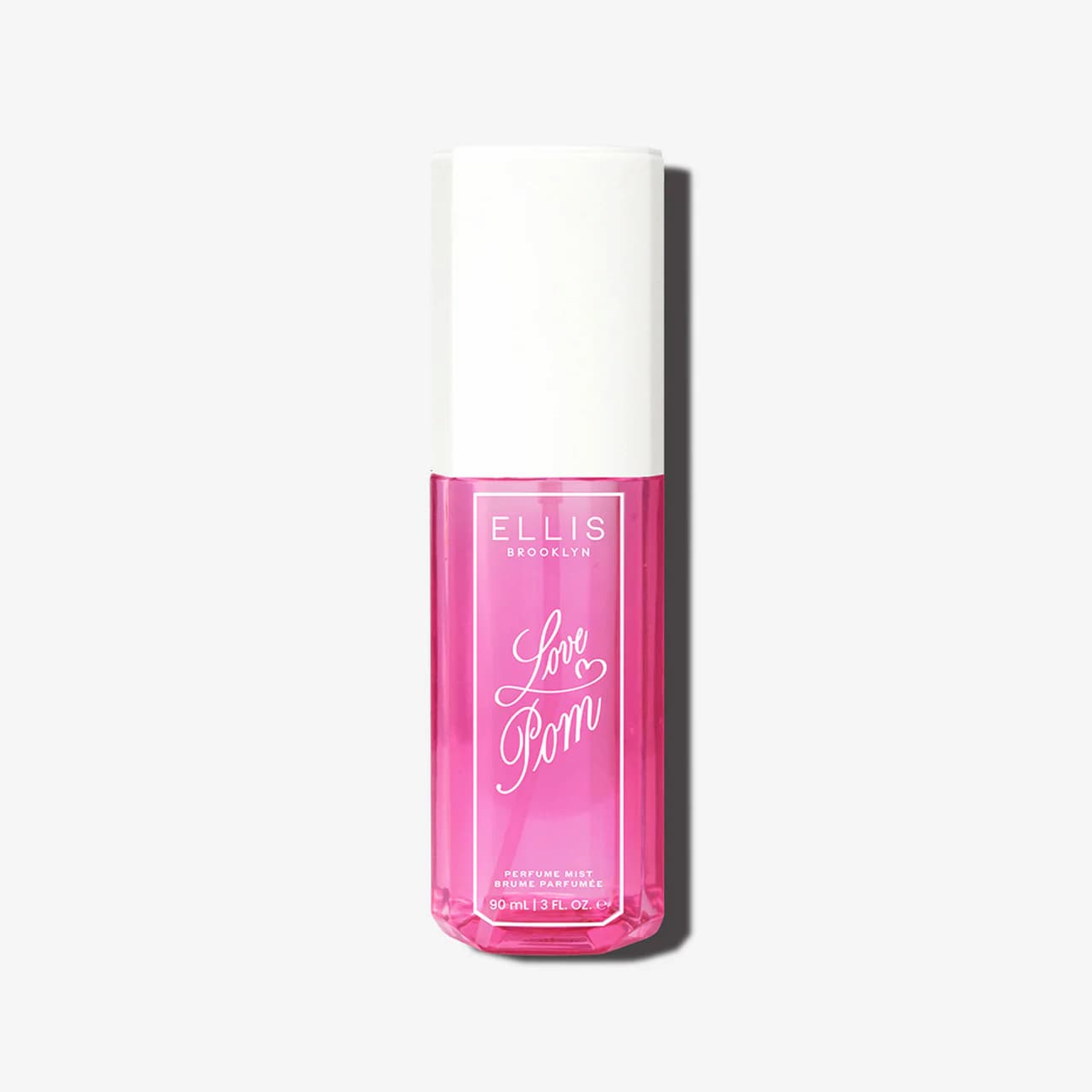 Pink bottle with white cap labeled 'Love Pom' by Ellis Brooklyn on an off-white background.