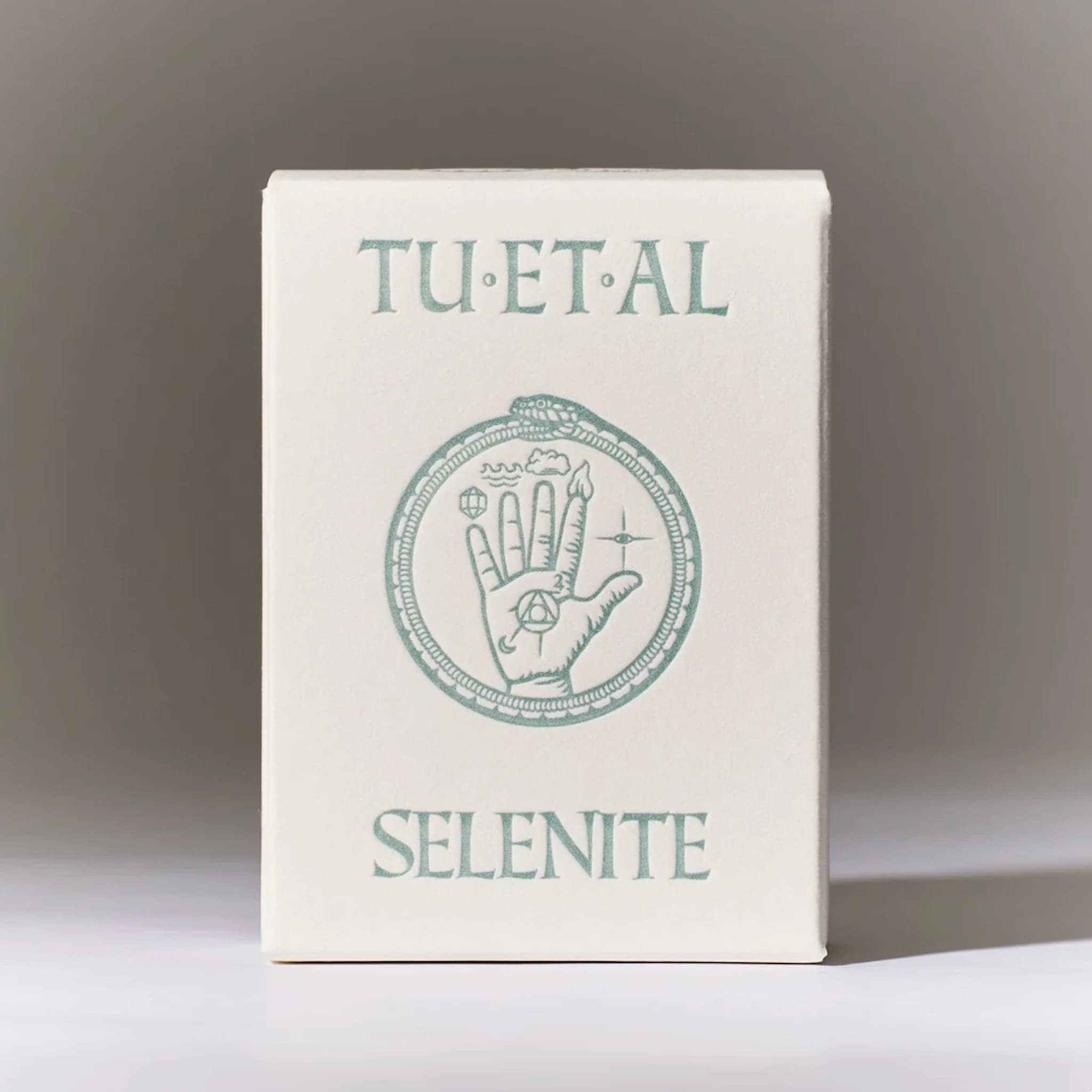Selenite soap packaging with 'TU ET AL' branding on a neutral background