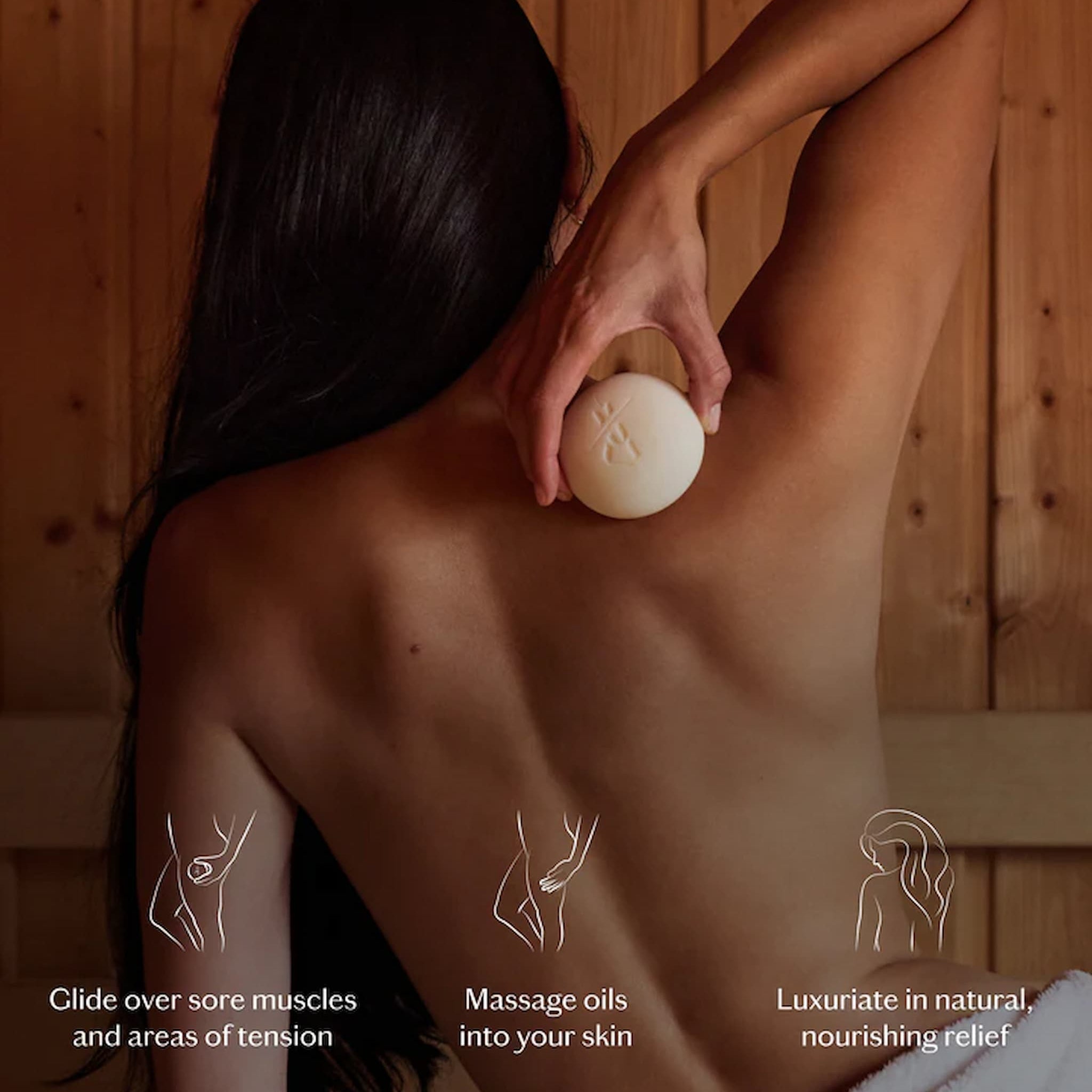 Person holding a lotion bar against their back in a wooden room, with text on how to use it.