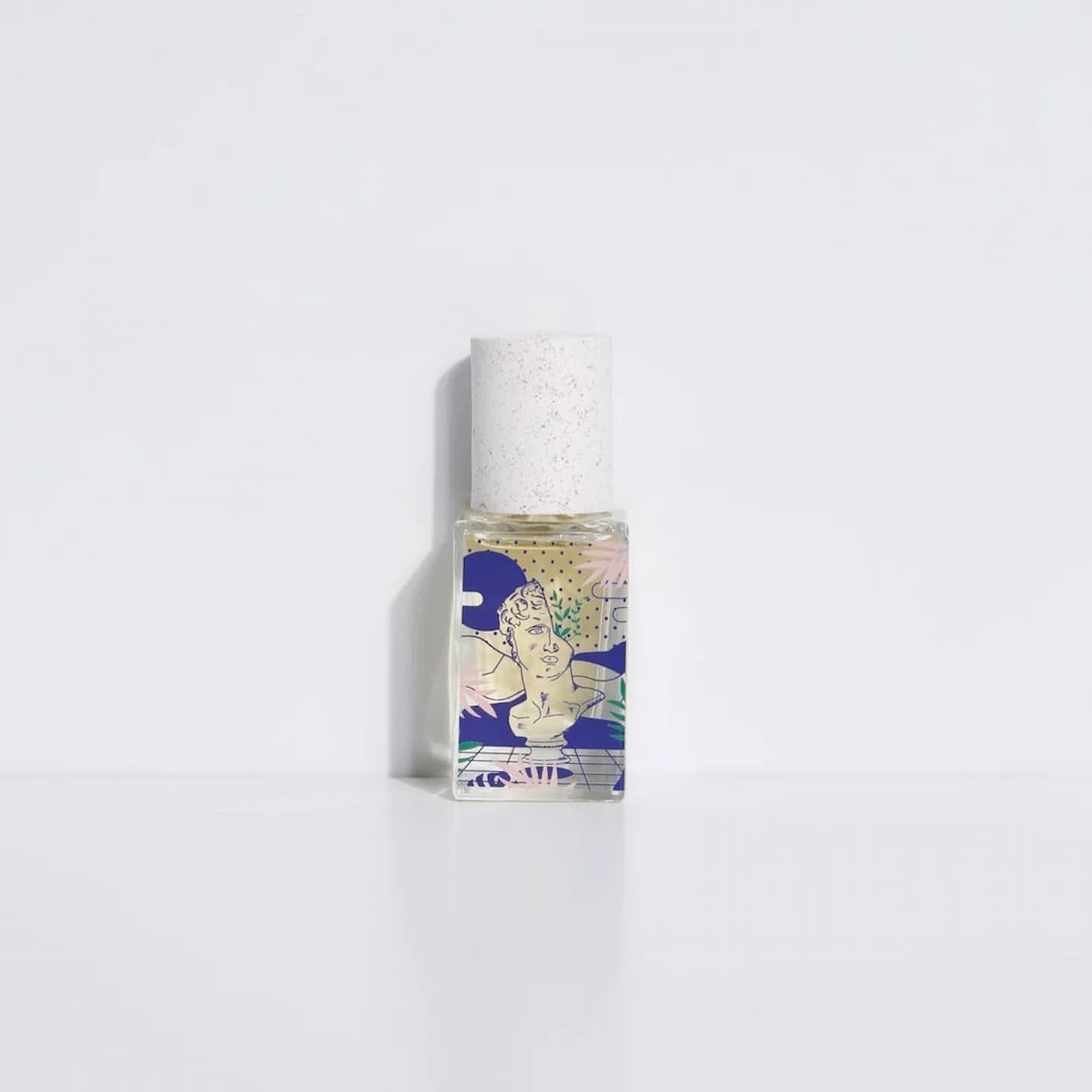 Small bottle with a colorful label on a white background