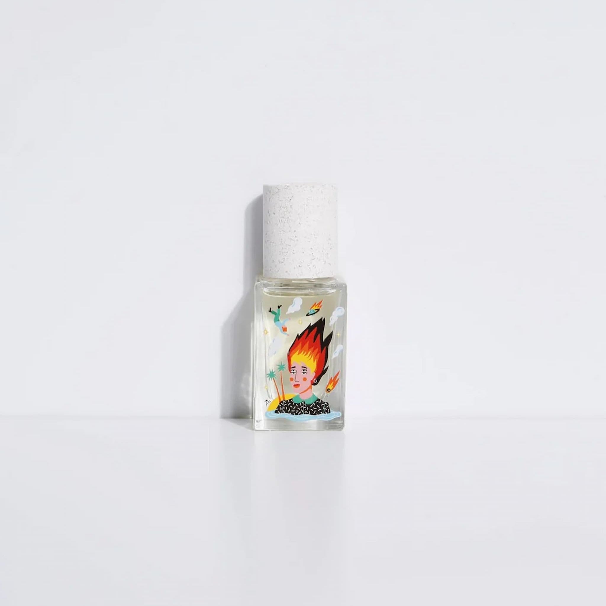 Small bottle with a colorful label featuring a face on a white background