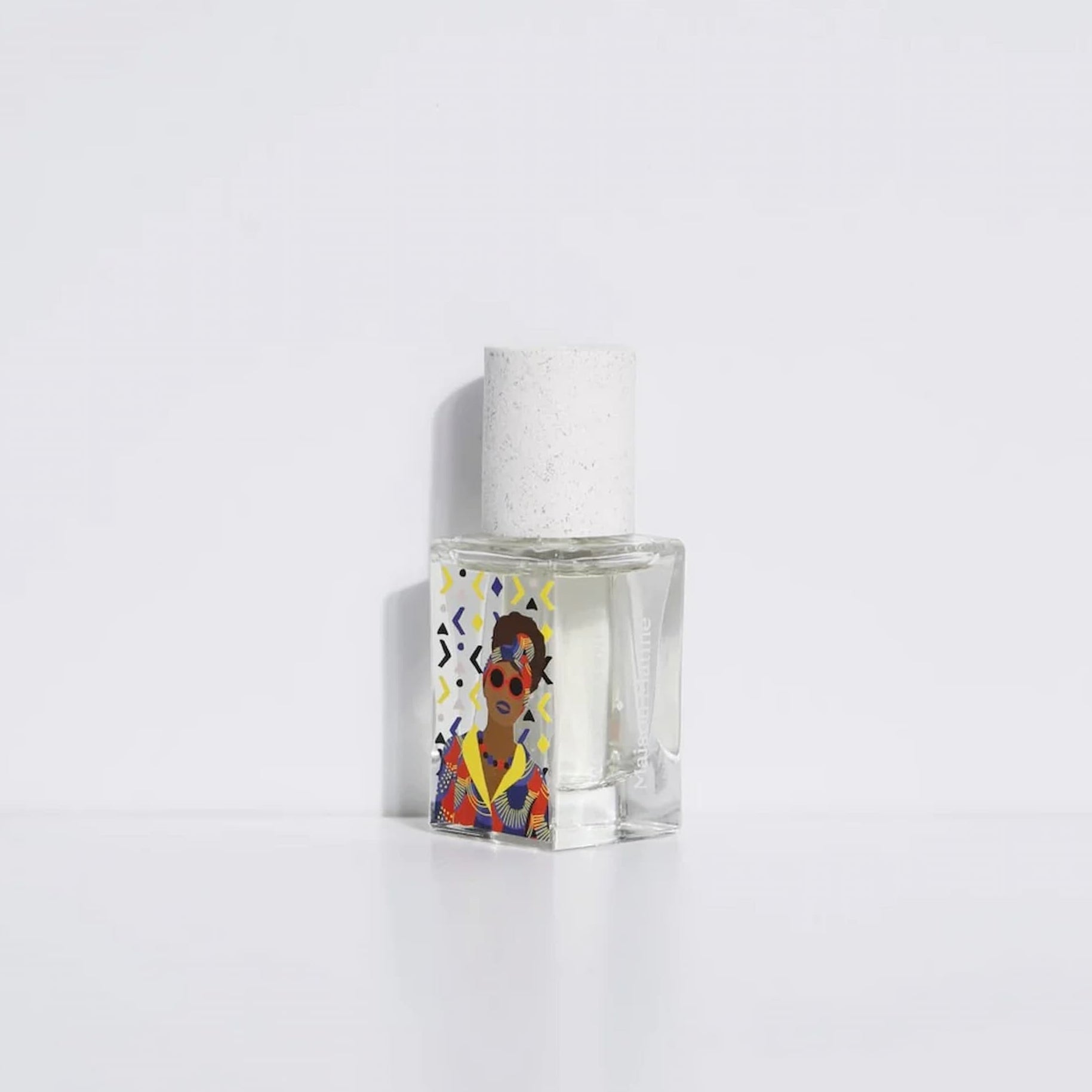 Small clear bottle with a colorful label featuring a person on a white background