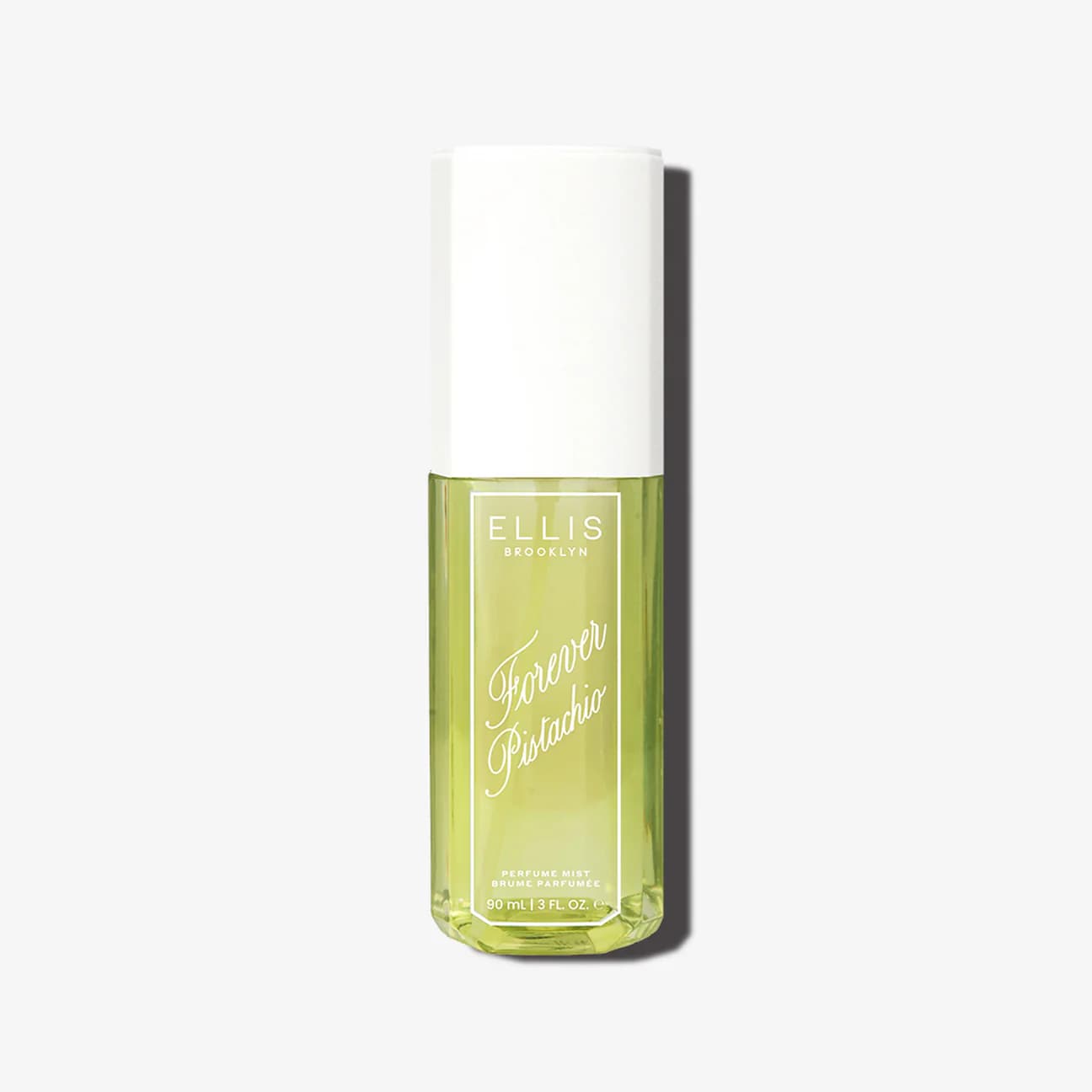 Bottle of Ellis Brooklyn Forever Pistachio perfume mist on a white background.
