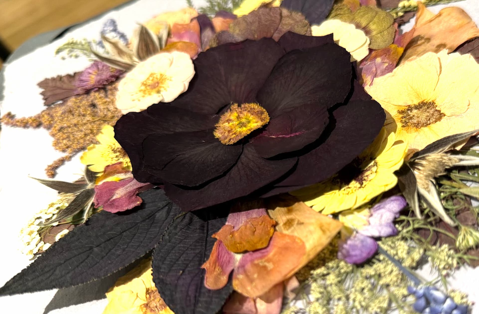 Close-up of a pressed wedding bouquet on watercolor paper by Witch Hazel, Hudson Valley, NY.