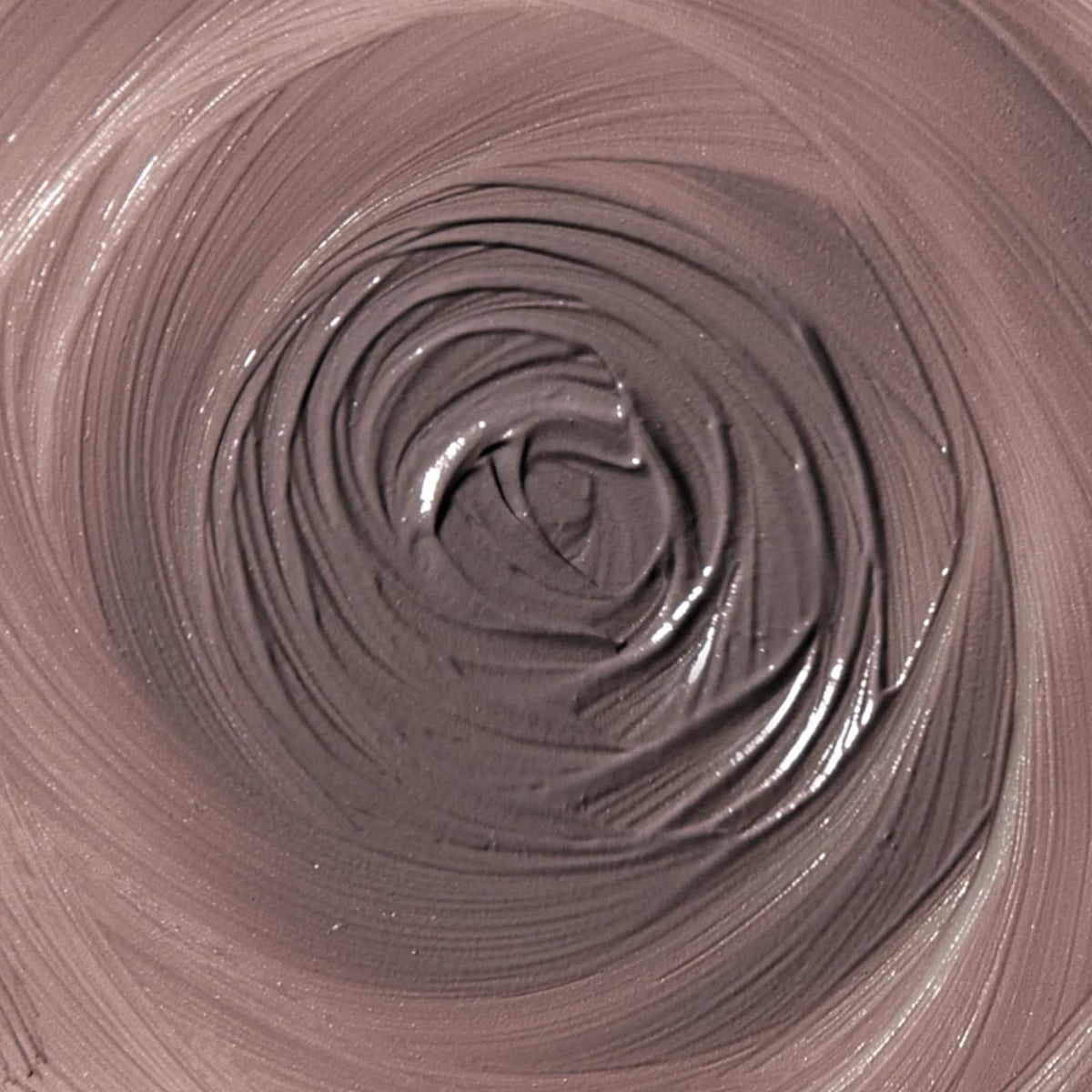 A close-up of Rituel de Fille Inner Glow Creme Pigment in "Intuition" spread out into a swirl.