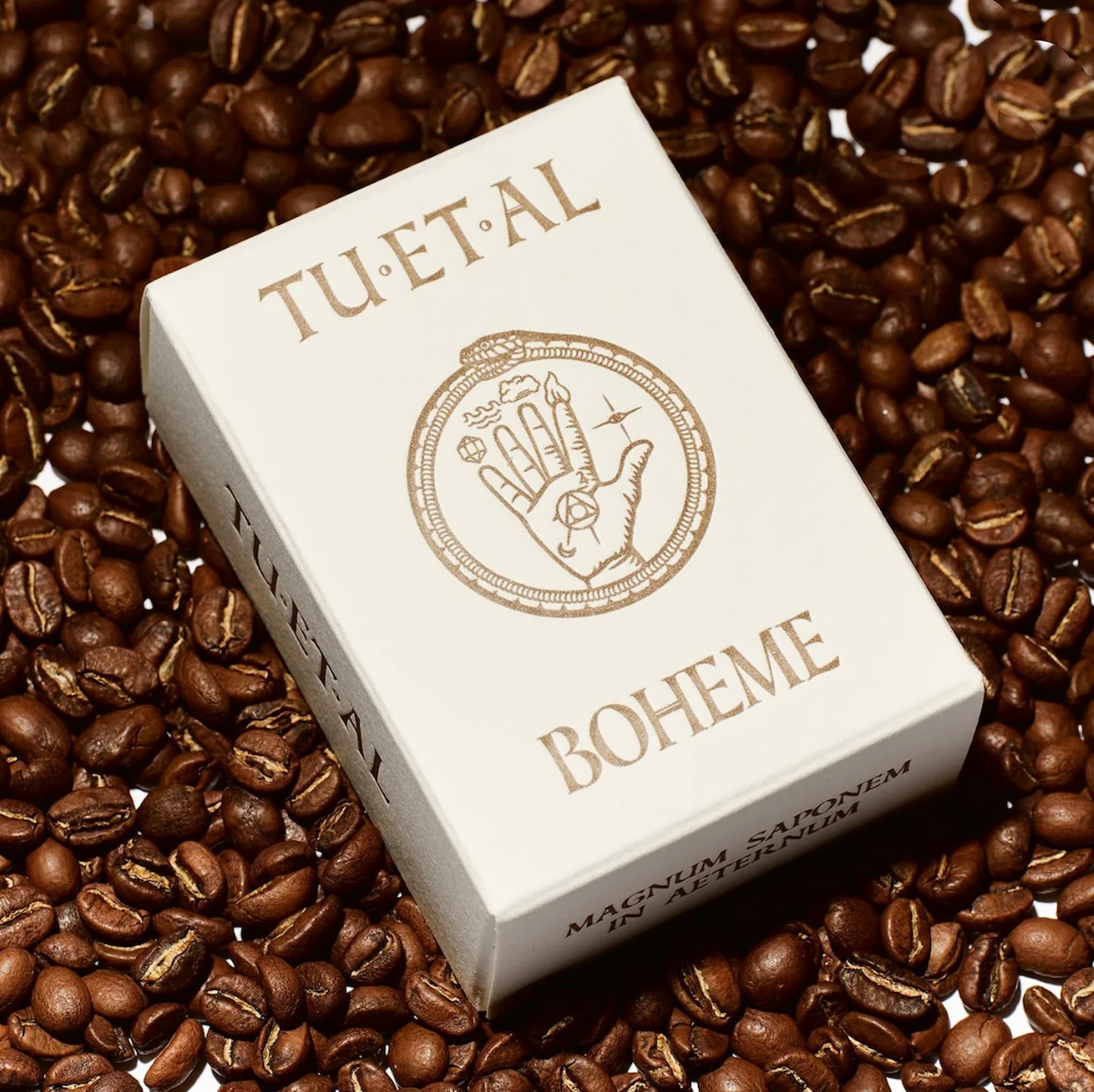 A box of bar soap that reads TU ET AL BOHEME on a background of coffee beans.