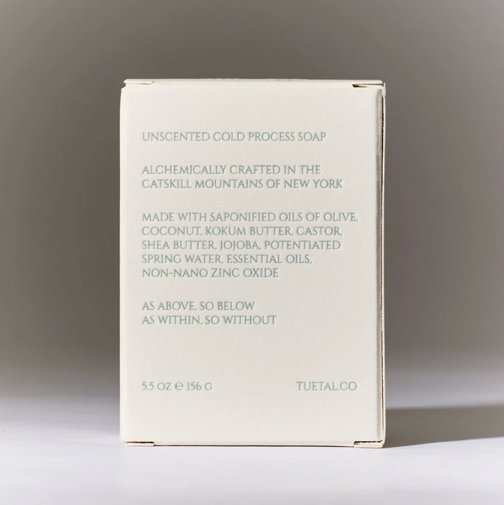 Unscented cold process soap packaging with text on a neutral background