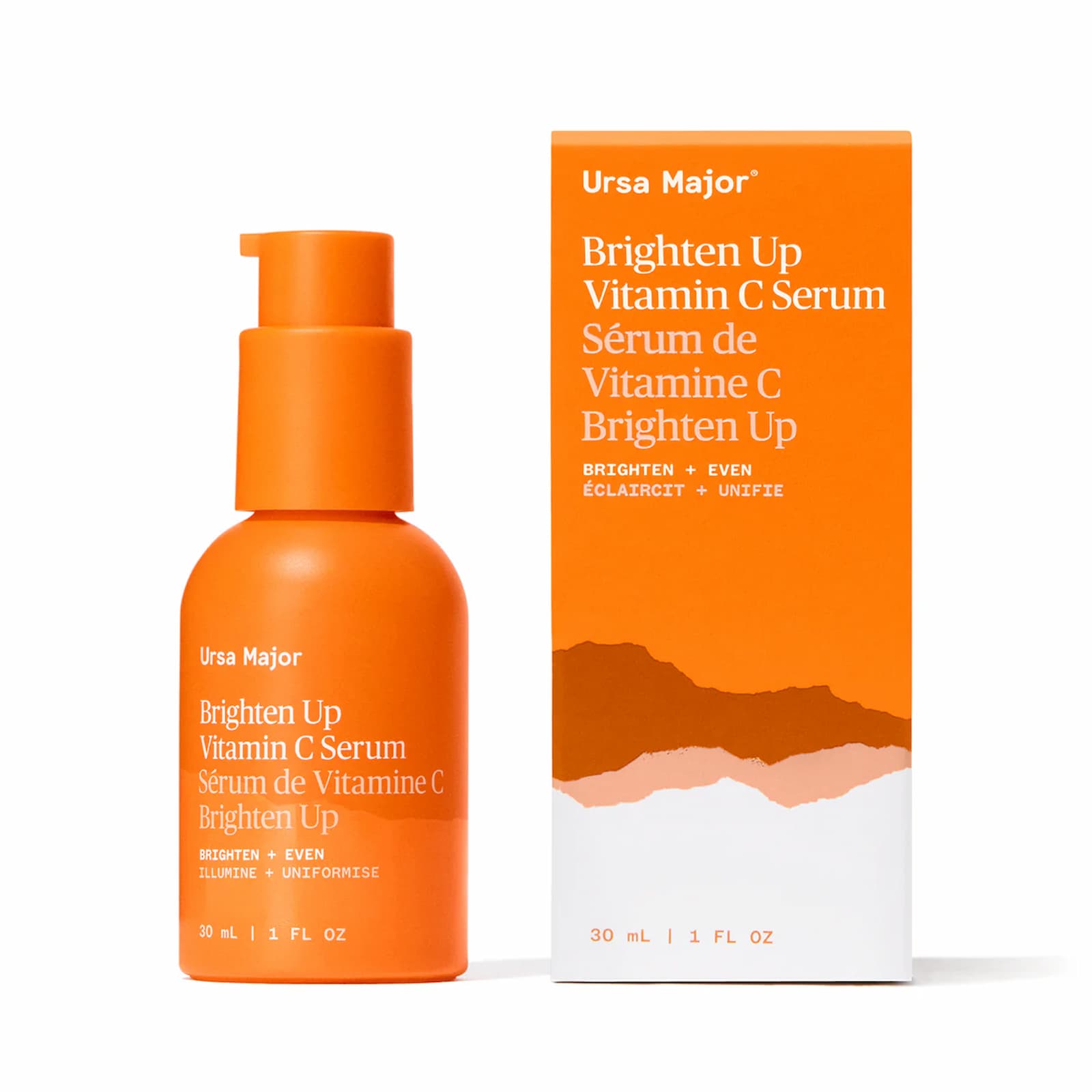 Ursa Major Brighten Up Vitamin C Serum in an orange bottle, next to the orange-and-white box for the serum.